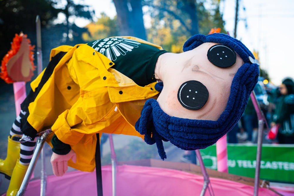 The State News homecoming float during the 2024 MSU Homecoming Parade on Oct. 18, 2024. The float's design was inspired by the 2009 film "Coraline," and put together by employees of The State News.