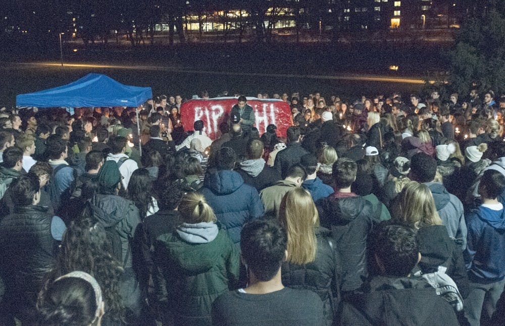 Hundreds of friends and family members gather together for a candlelight vigil on Nov. 29, 2016 at The Rock to mourn the passing of former student Abhi Shah.