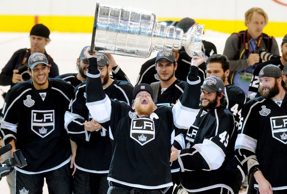 Los Angeles Kings' Matt Greene raises the Stanley Cup after defeating the New Jersey Devils in Game 6 of the Stanley Cup Final at Staples Center in Los Angeles on Monday, June 11, 2012. Wally Skalij/Los Angeles Times/MCT