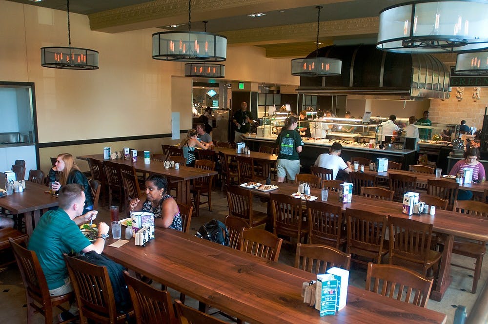 <p>Students eat lunch in the newly renovated Heritage Commons at Landon on Sept. 2, 2014. Landon Hall just opened for the fall semester after being closed for major renovations during the 2013-2014 academic year. Jessalyn Tamez/The State News. </p>