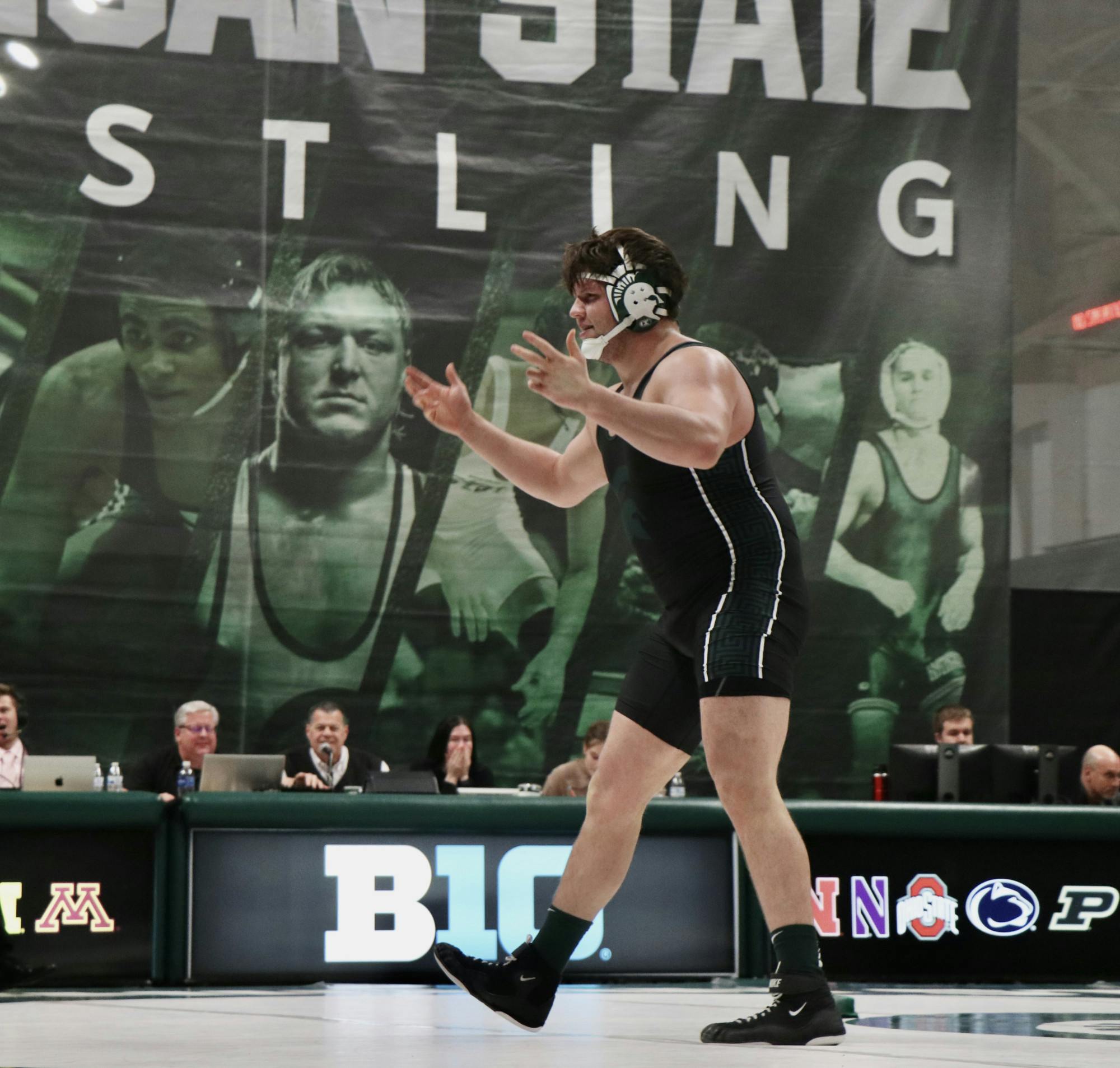 <p>Josh Terrill hypes up MSU fans after winning his match against Gannon Rosenfeld from Wisconsin at Jenison Fieldhouse on Jan. 26, 2024.</p>