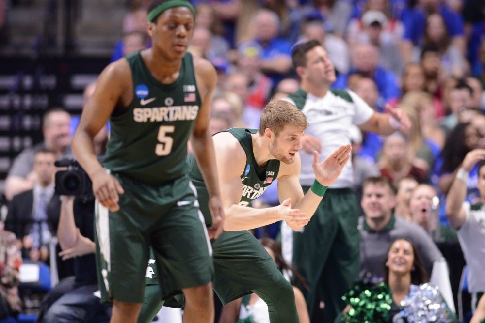 Kyle Ahrens hypes his team up during round two of the NCAA tournament against Kansas.