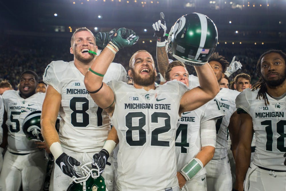Senior tight end Josiah Price (82) celebrates the win against Notre Dame on Sept. 17, 2016 at Notre Dame Stadium in South Bend, Ind. The Spartans defeated the Fighting Irish, 36-28.