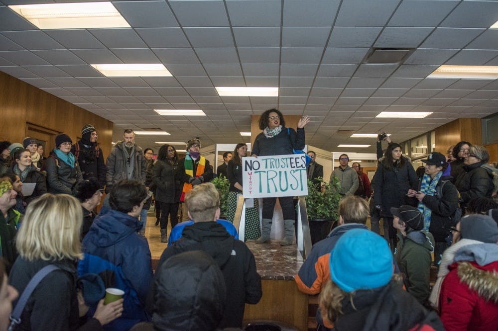 Associate professor of educational administration Terah Chambers addresses protesters before the MARCH on Hannah on Feb. 6, 2018 at Erickson Hall. Protesters marched from Erickson Hall to the Hannah Administration Building and had a list of demands, including the resignation of the Board of Trustees and Interim President Engler. (Nic Antaya | The State News)
