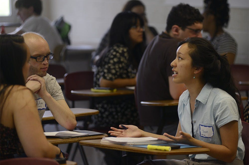 <p>During a group discussion in the Combating White Supremacy Culture in Radical Spaces workshop Trish Abalo (right) speaks as Justin Murshak (left) listens May 29 in Berkey Hall. Wyatt Giangrande/State News</p>