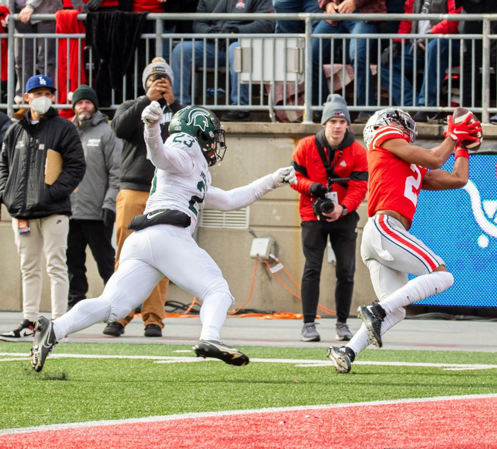 <p>Ohio State&#x27;s Chris Olave (2) catches the ball, resulting in a touchdown during Michigan State&#x27;s loss to Ohio State on Nov. 20, 2021.</p>