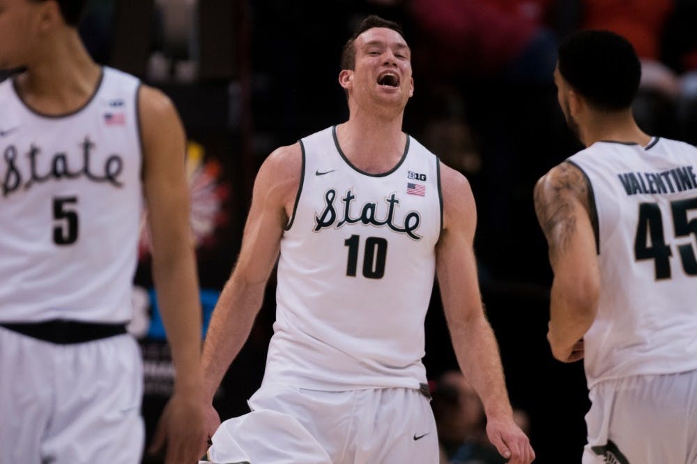 Senior forward Matt Costello celebrates after scoring a basket during the second half of the game on March 11, 2016 at Bankers Life Fieldhouse in Indianapolis, Indiana. The Spartans defeated the Buckeyes 81-54.