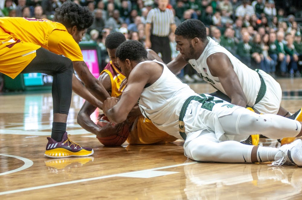 <p>The Spartans and University of Louisiana-Monroe fight for the ball during the game against University of Louisiana-Monroe at Breslin Center on Nov. 14, 2018. The Spartans lead the Warhawks at halftime, 35-29.</p>