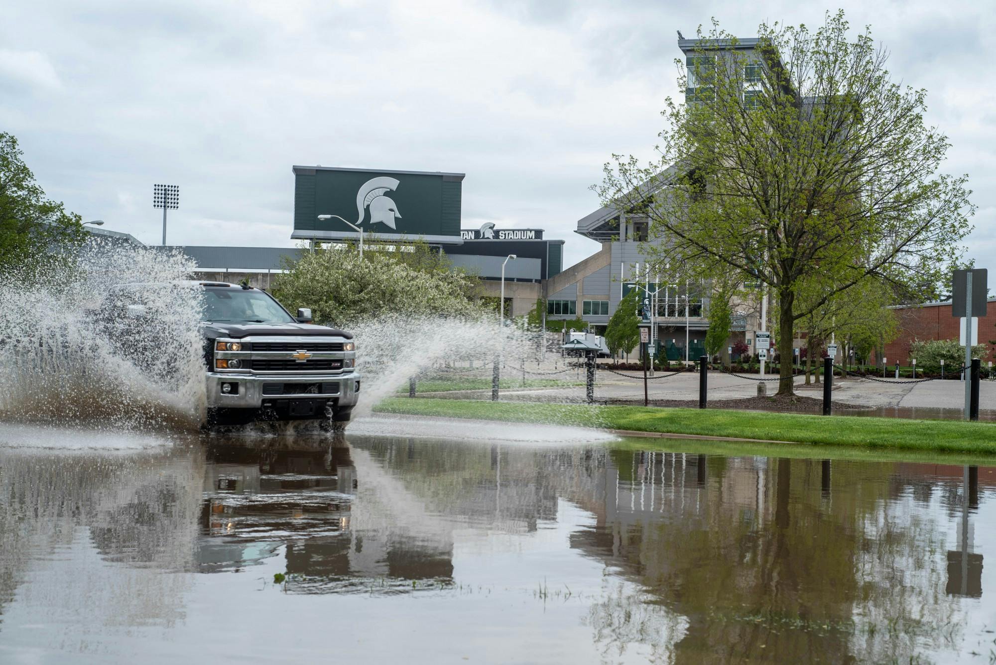 A car drives past Spartan Stadium on March 19, 2020