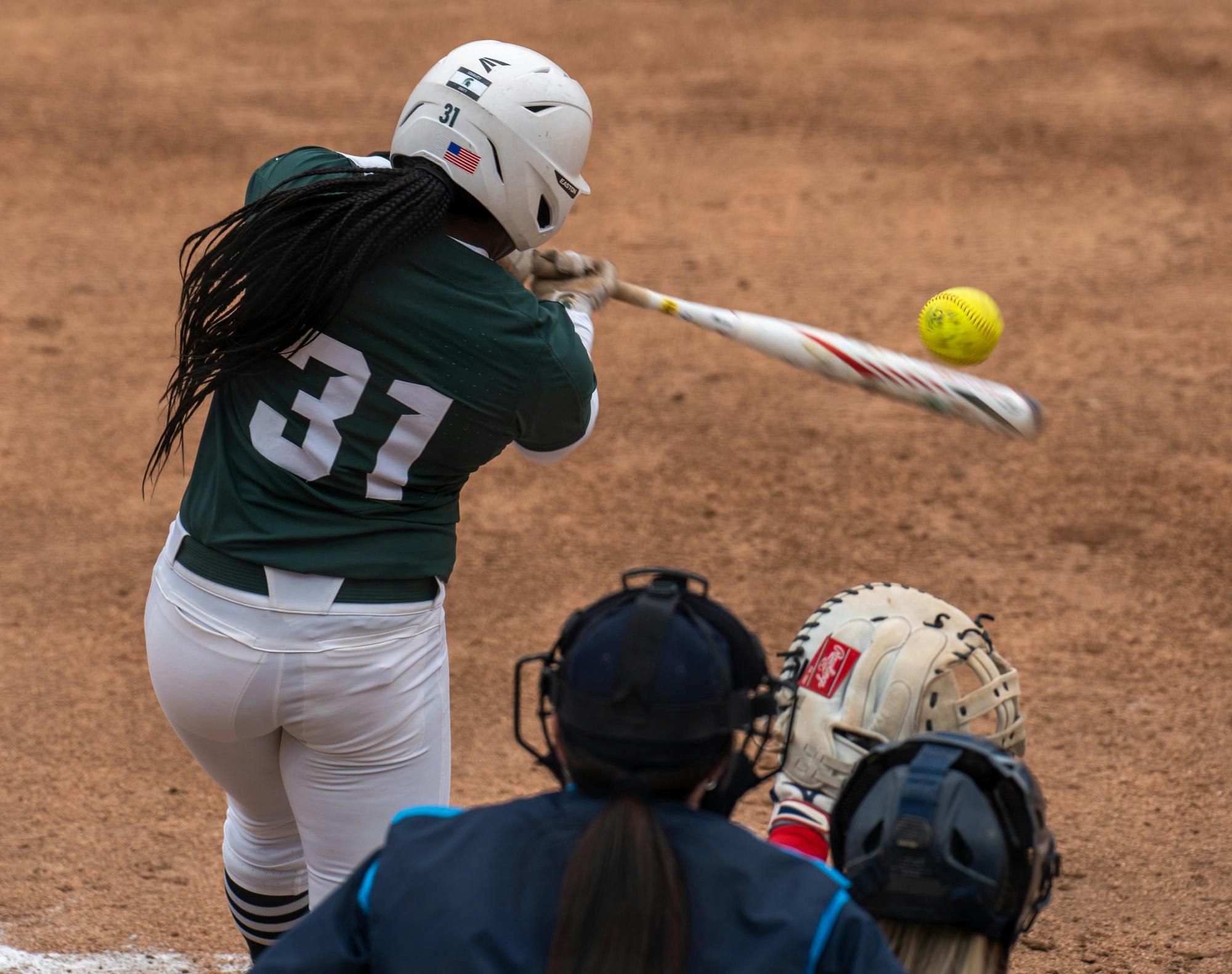 <p>Sophomore infielder Zaquai Dumas (31) hits a pitch during the sixth inning. The Spartans shut out the Titans, 2-0, in the first game of their doubleheader on March 29, 2022. </p>