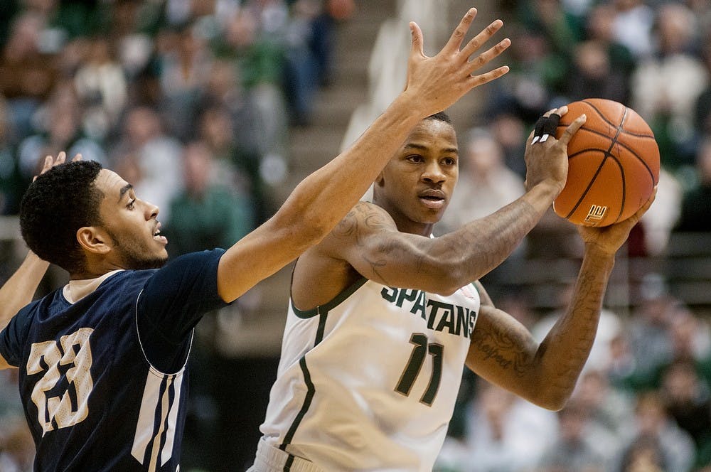 	<p>Senior guard Keith Appling looks for an open teammate during the game against Mount St. Mary&#8217;s on Nov. 29, 2013, at Breslin Center. Khoa Nguyen/The State News</p>