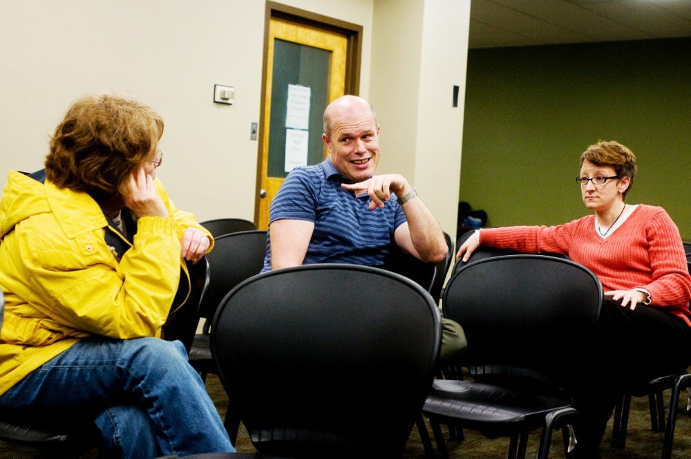 From left gay, lesbian, bisexual, and transgender faculty, staff, and graduate student association (GLFSA) members Martha Bates, Grant Littke, and LBGT Resource Center interim director Deanna Hurlbert discuss the different policies and regulations MSU puts for the gay population to live together on campus on Monday night inside Erickson Hall. 