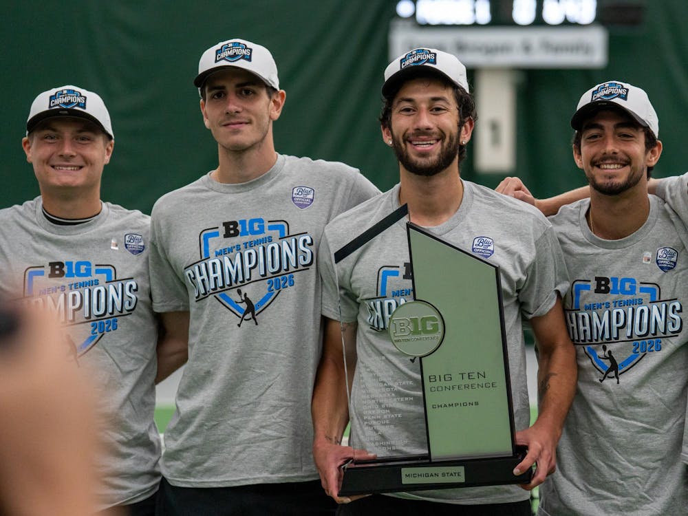 <p>Michigan State senior Ozan Baris with the Big Ten Men's Tennis Title Trophy alongside teammates at the MSU Tennis Center in East Lansing, Michigan on Sunday, April 19, 2026.</p>
