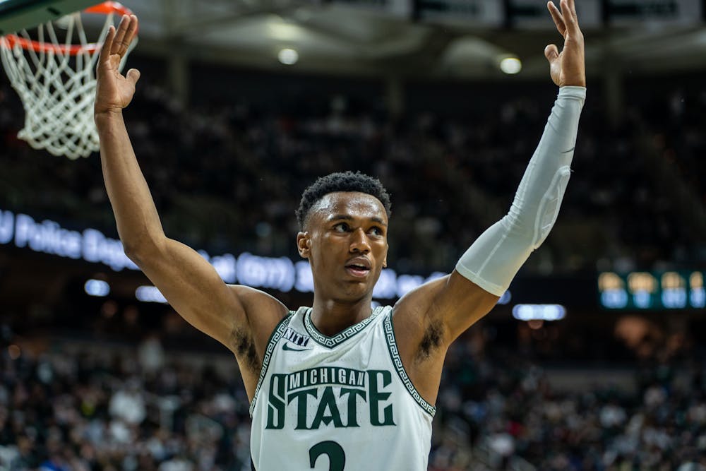 <p>Junior guard Tyson Walker (2) cheers with the crowd. The Spartans fell to the Illini 79-74 at the Breslin Center on Feb 19, 2022.</p>