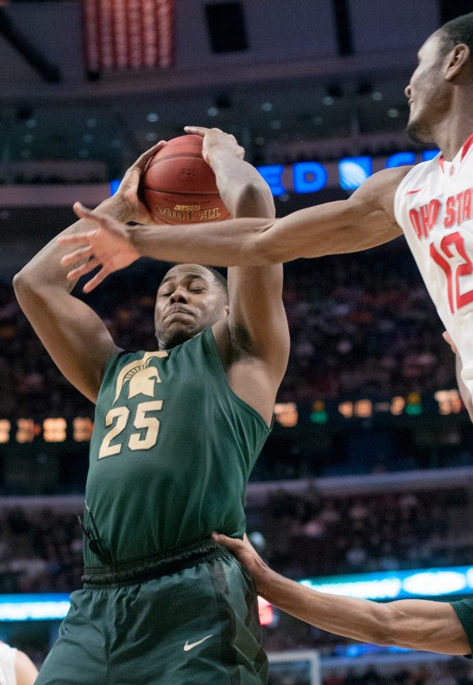 	<p>Senior center Derrick Nix attempts to shoot the ball as Ohio State forward Sam Thompson goes to block during the semifinal round of the Big Ten Tournament on March 16, 2013, at United Center in Chicago, Ill. Nix was the leading scorer for the Spartans with 17 points, but the Buckeyes beat the Spartans, 61-58. Natalie Kolb/The State News</p>