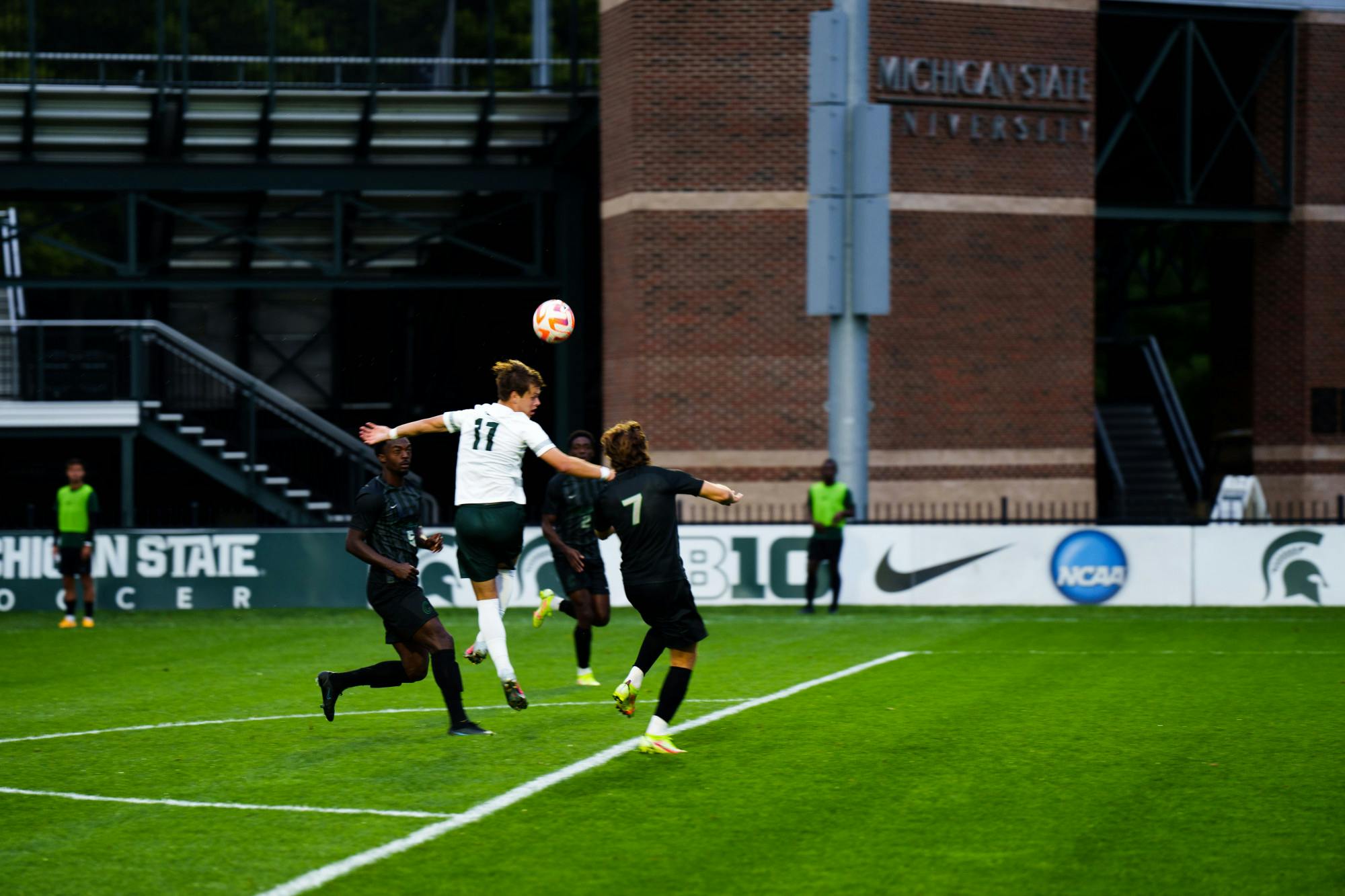 <p>Sophomore forward Zach Babiak (11) goes for a header during an MSU and Chicago State University men's soccer game at DeMartin field on Sept. 12, 2022. The Spartans defeated the Cougars 4-1.</p>