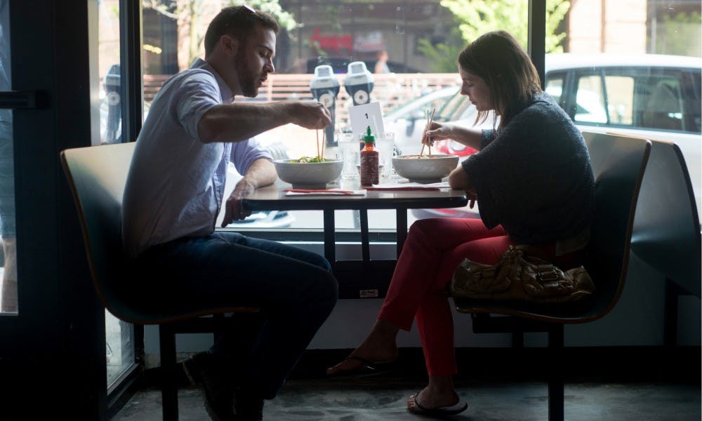 <p>Okemos, Mich., residents Matthew and Jamie Bernard enjoy lunch together Sept. 1, 2015, at Pho Viet, 350 Albert Street, in East Lansing. Pho Viet opened to the public last week and offers a variety of Vietnamese options on their menu. Alice Kole/The State News</p>