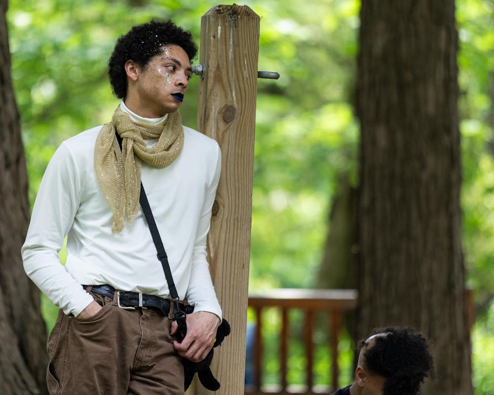 <p>An attendee of the Music and the Garden event listens to the songs being performed in East Lansing, Mich., on June 28, 2026.</p>