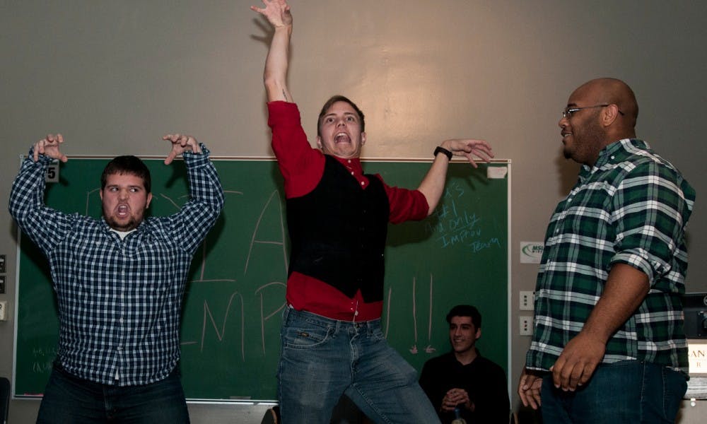 <p>From left, communications freshman Alec Comes, computer science sophomore Terrence Peugh and public policy senior Robert Parsons perform a scene during a Roial Players improv show on Nov. 13, 2015 in the McDonel Hall kiva.</p>
