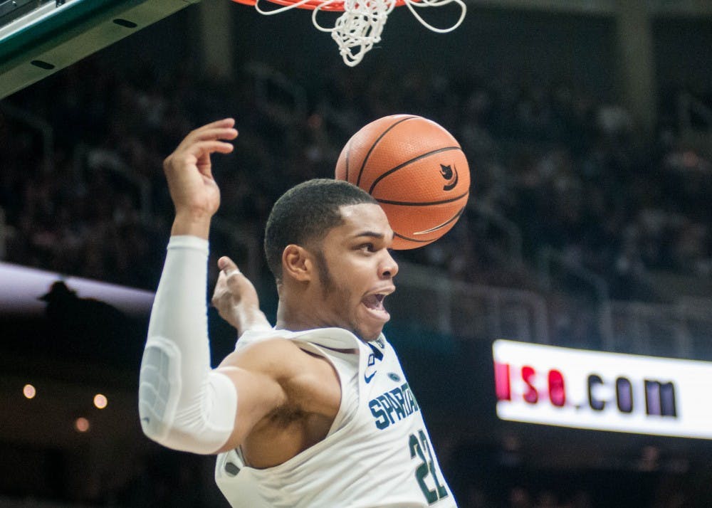 Sophomore guard and forward Miles Bridges (22) after he dunks the ball during the game against Nebraska on Dec. 3, 2017, at Breslin Center. The Spartans defeated the Cornhuskers 86-57.