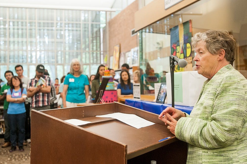 	<p><span class="caps">MSU</span> president Lou Anna K. Simon addresses the crowd at East Lansing Welcomes the World on Sept. 7, 2013 at the East Lansing Public Library. The event was aimed at celebrating the large international community at <span class="caps">MSU</span>. Khoa Nguyen/ The State News</p>