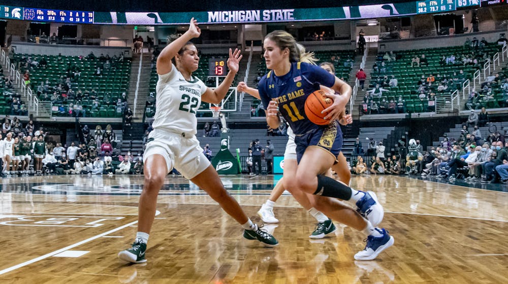 Michigan State's Moira Jones (22) defends against Notre Dame's Sonia Citron (11) during Michigan State's loss on