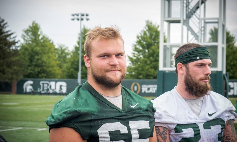 <p>Seniors offensive lineman Brian Allen and linebacker Chris Frey are pictured on Aug. 24, 2017 at the practice fields behind Duffy Daugherty Football Building. Allen and Frey are the two captains of the MSU football team.</p>