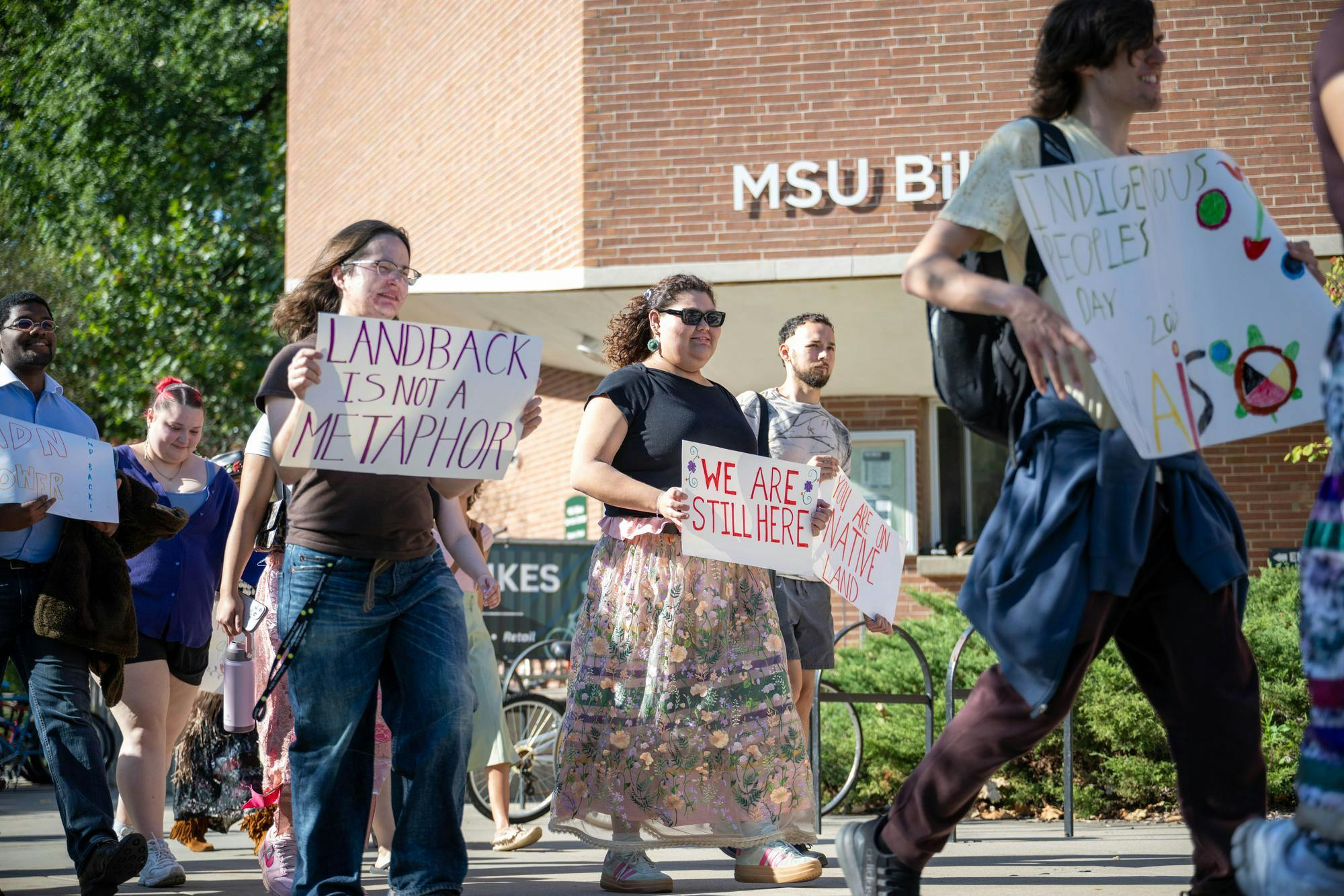 <p>Michigan State students march toward The Rock on Farm Lane during an Indigenous Peoples’ Day march hosted by the North American Indigenous Student Organization at Michigan State University in East Lansing, Mich., on Monday, Oct. 12, 2026.</p>