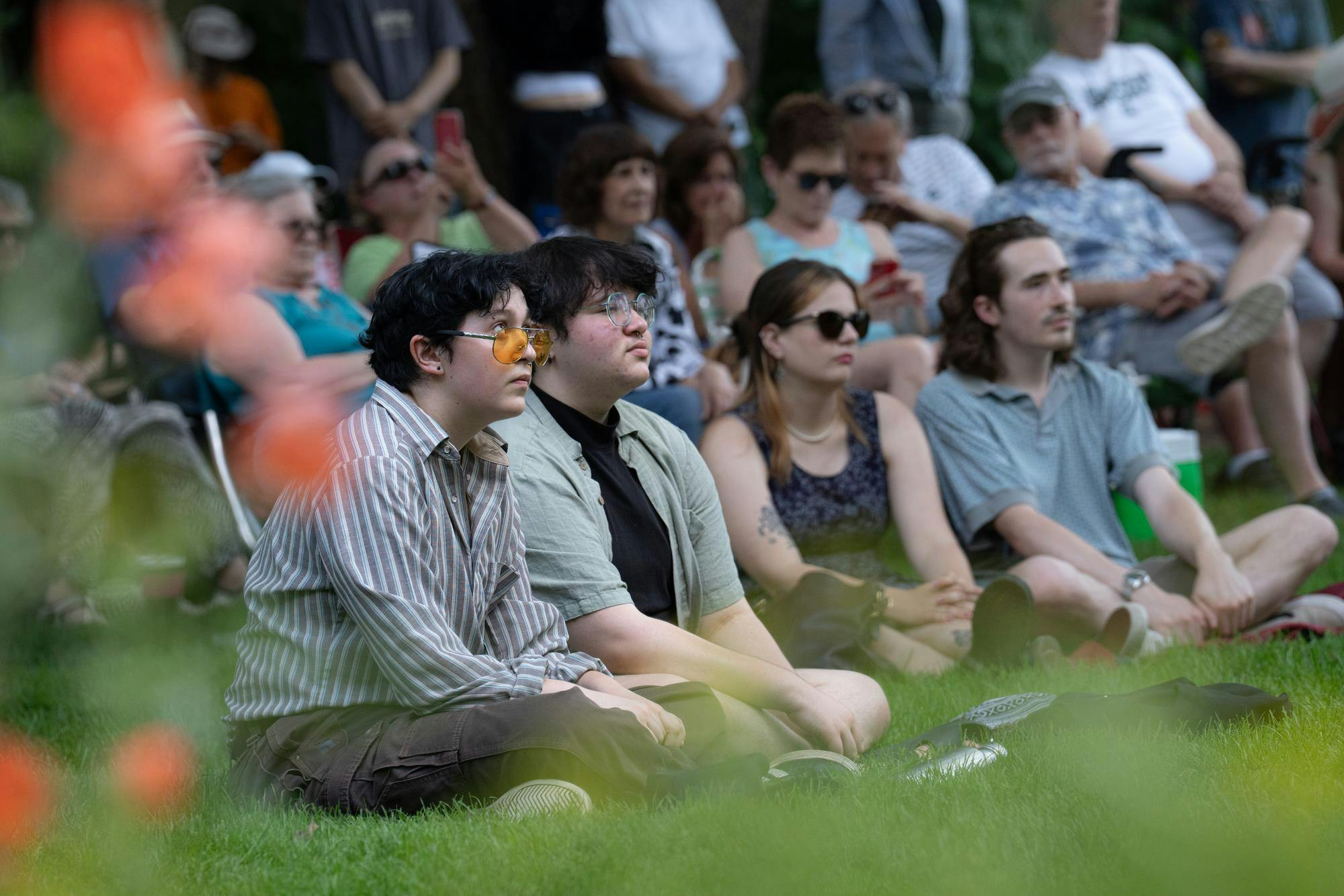 <p>Audience members sit in the grass watching The Moderno Trio perform at the tenth annual Music and the Garden at Beal Garden on June 29, 2025.</p>