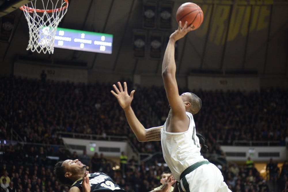 Freshman forward Nick Ward (44) goes for a dunk in the first half of the men's basketball game against Purdue on Feb. 18, 2017 at Mackey Arena. 