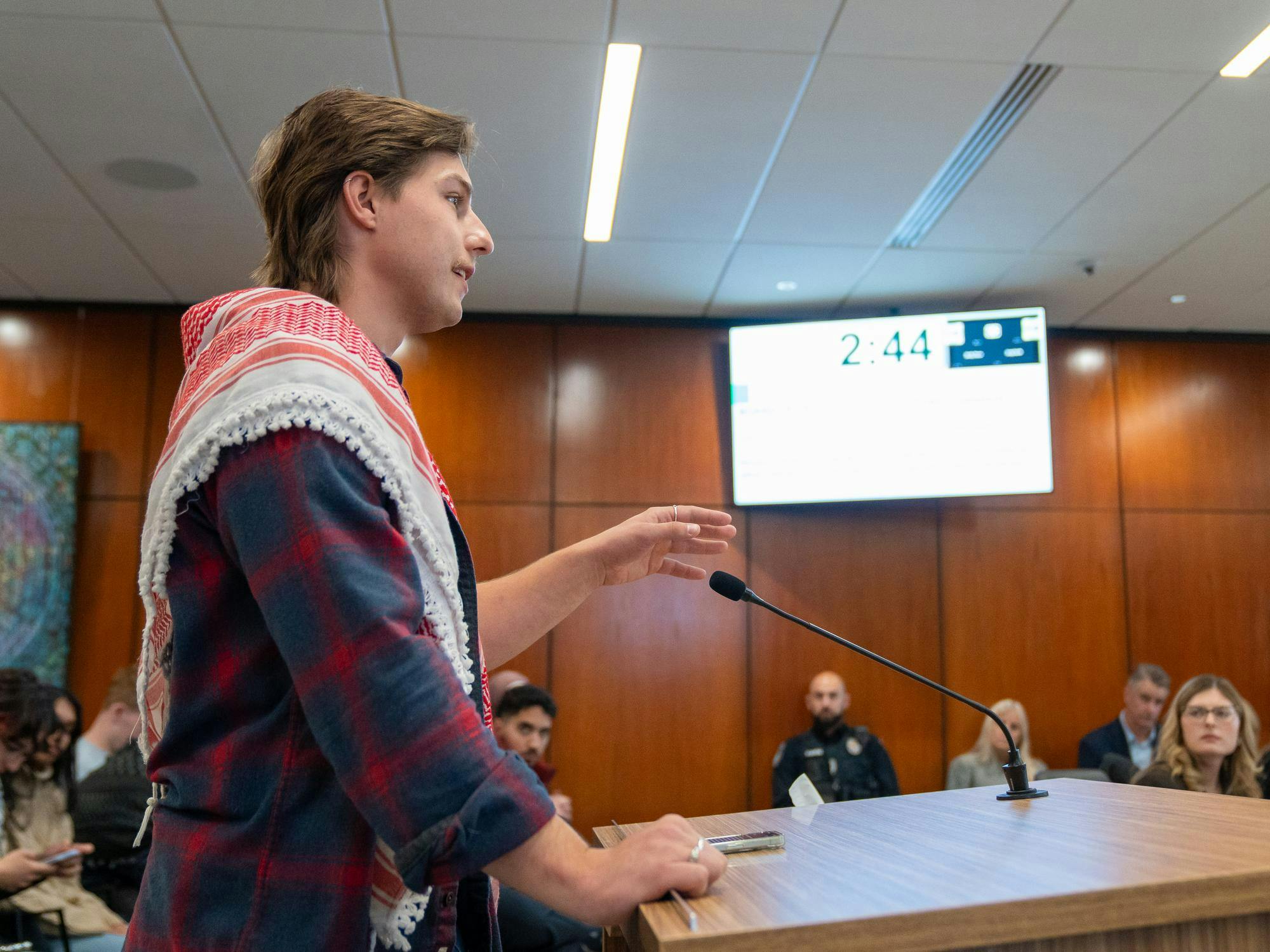<p>MSU student Eli Folts speaks to the MSU Board of Trustees at the first meeting inside Hannah Administration Building in East Lansing, Michigan on Friday, Oct. 31, 2025. </p>
