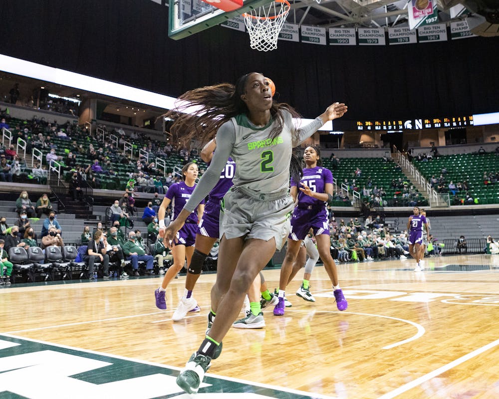 <p>Graduate Student Forward Tamara Farquhar runs out of bounds after trying to make a goal during the Spartans&#x27; 65-46 win against Northwestern on Jan. 16, 2022. </p>