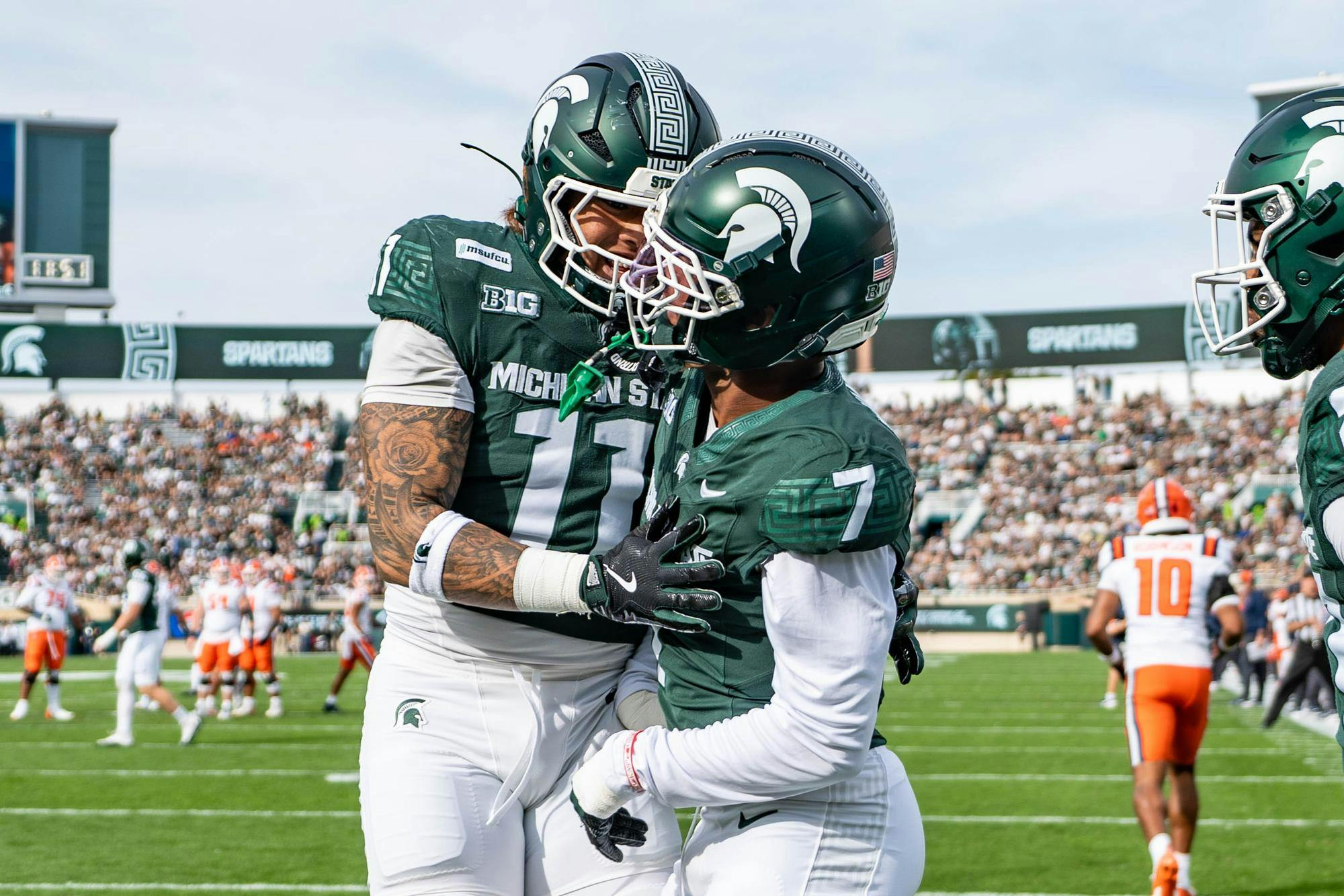 <p>Michigan State safety Michael Richard (7) celebrates with edge, Anelu Lafaele (11) after making a stop against the Illinois offense in the opening minutes of their matchup at Spartan Stadium in East Lansing, Mich., on Saturday, Oct. 10, 2026.</p>