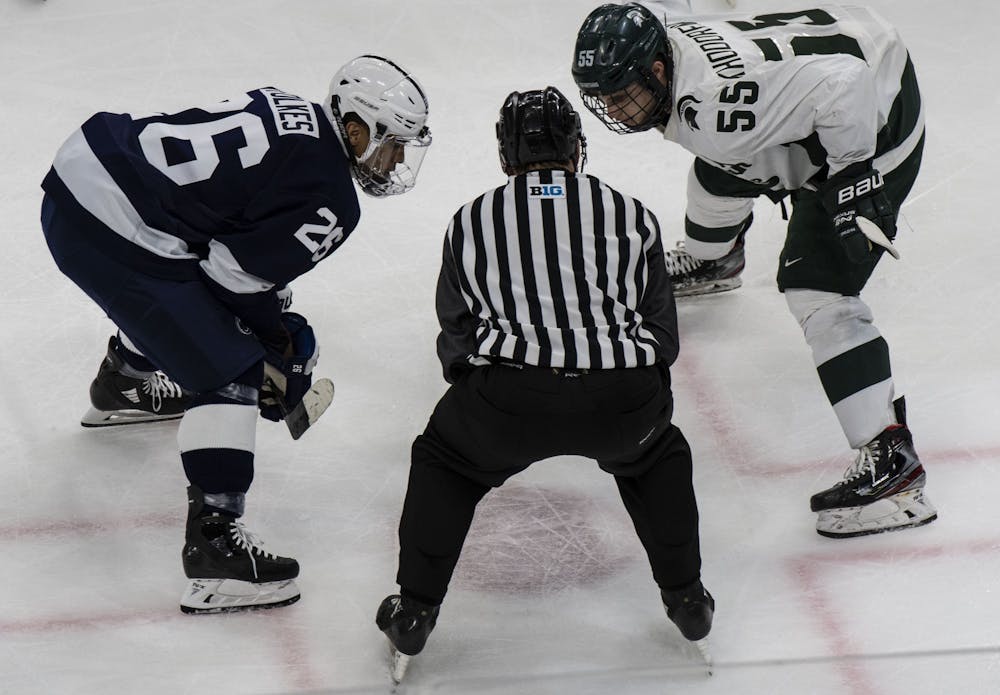 <p>Senior center Patrick Khodorenko (55) and Penn State&#x27;s right wing Liam Folkes wait for the puck to be dropped in the first period. Michigan State fell to Penn State 2-1 on Jan. 25, 2020.</p>
