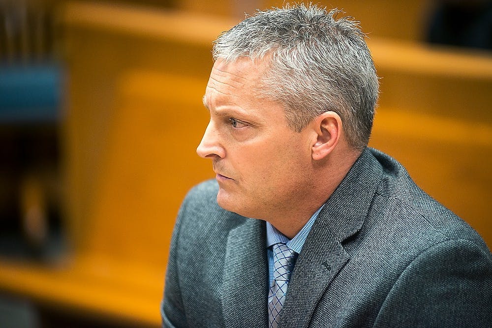 <p>Deputy Chief Assistant Prosecuctor John Dewane listens during the arraignment hearing of Ricard Taylor on May 14, 2014, at East Lansing 54B District Court. Taylor stands trial for seven felony charges. Danyelle Morrow/The State News</p>