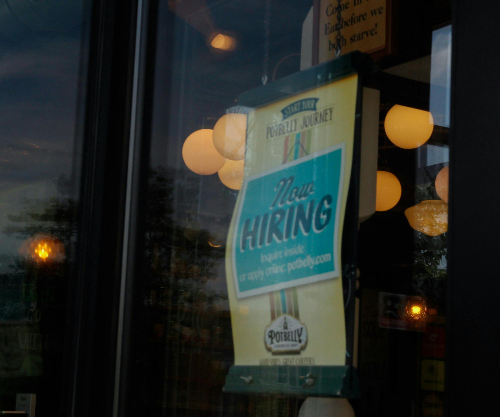 <p>A hiring sign is pictured at Potbelly on Grand River Ave. on June 23, 2021.</p>