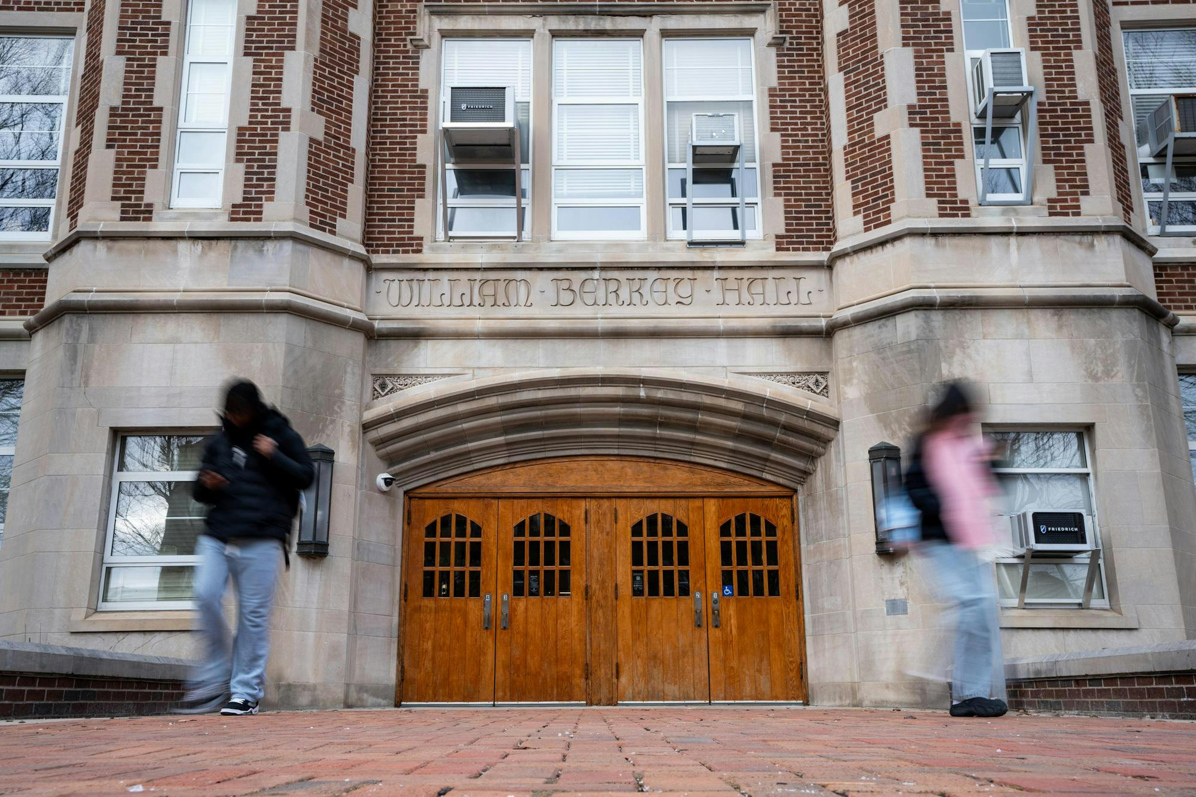 <p>Students walk outside of Berkey Hall in East Lansing, Michigan on February 11, 2025.</p>