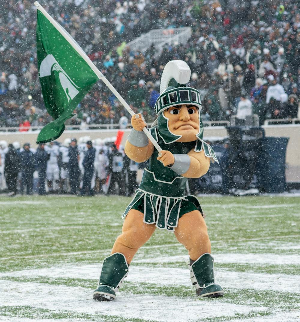 Michigan State's mascot Sparty waves a Spartan flag on Nov. 27, 2021.