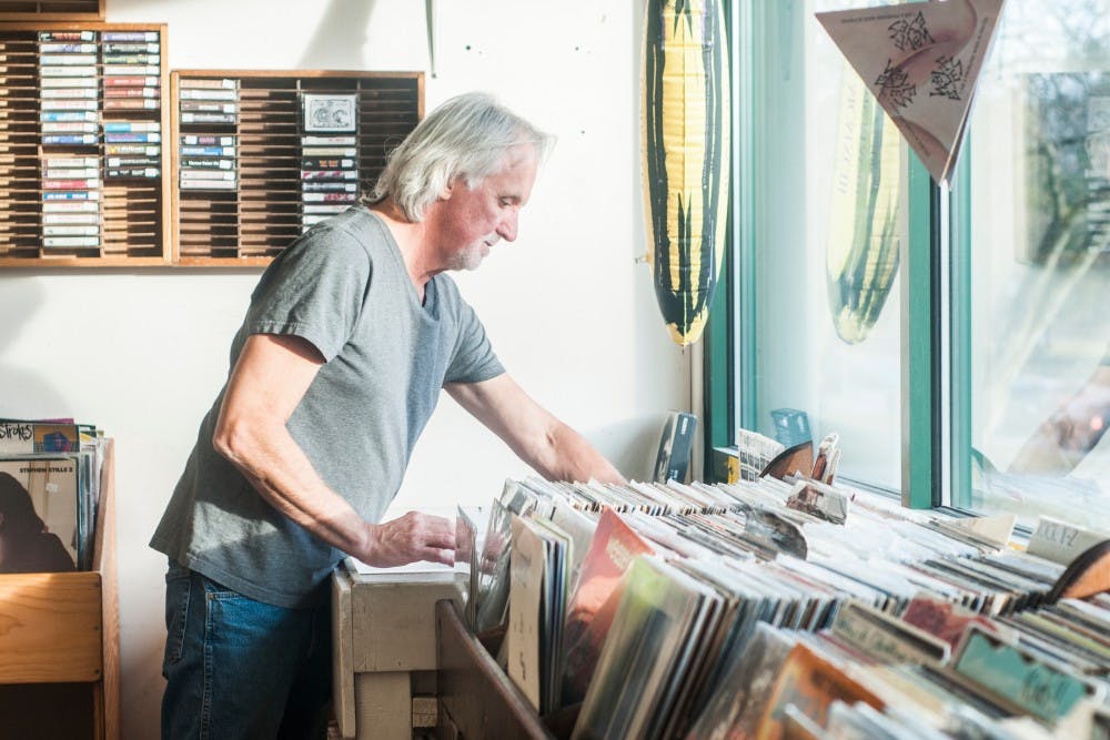Bath resident Dave Bernath sorts tapes on Feb. 20, 2017 at Flat, Black & Circular at 541 E Grand River Ave in East Lansing. Bernath has owned the store for forty years. "It doesn't really seem like work, and I get to listen to music all day. I've met a lot of people over the forty years," Bernath said. 