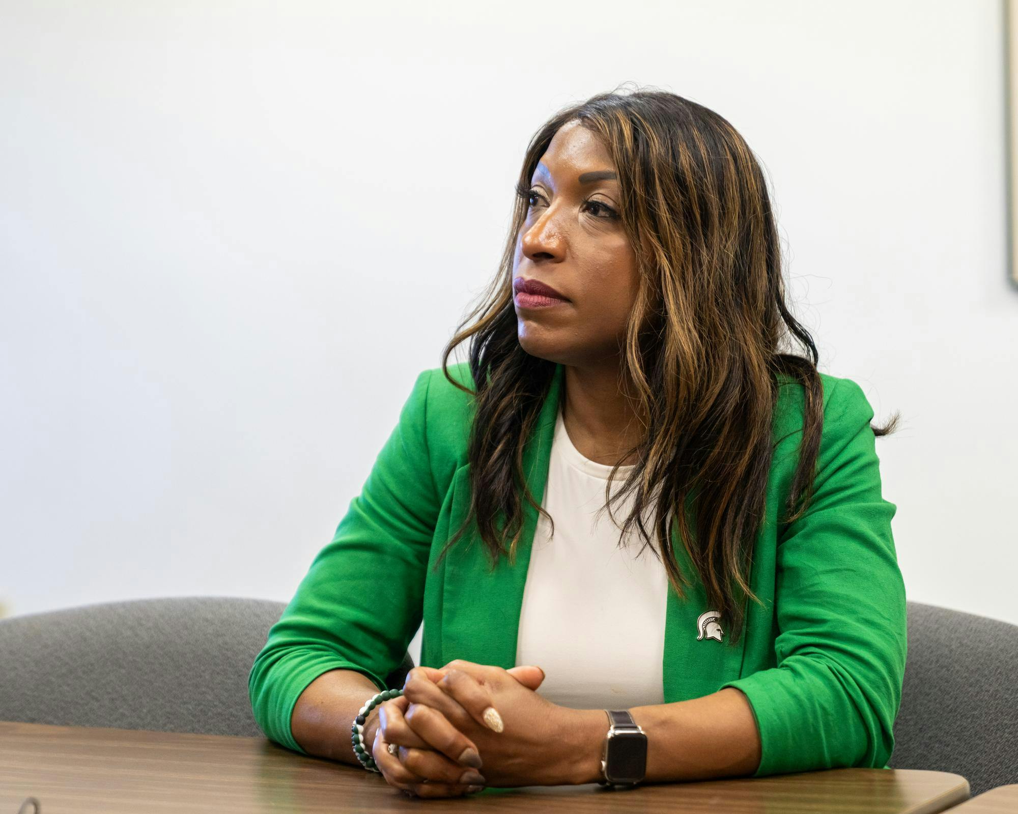 After a Board of Trustees meeting, MSU Chairperson Brianna Scott, listens intently to questions from media members in Benton Harbor, Mich., on June 12, 2026.