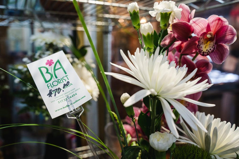 Flowers await their next home in the cold fridge at B/A florist on April 12, 2024.
