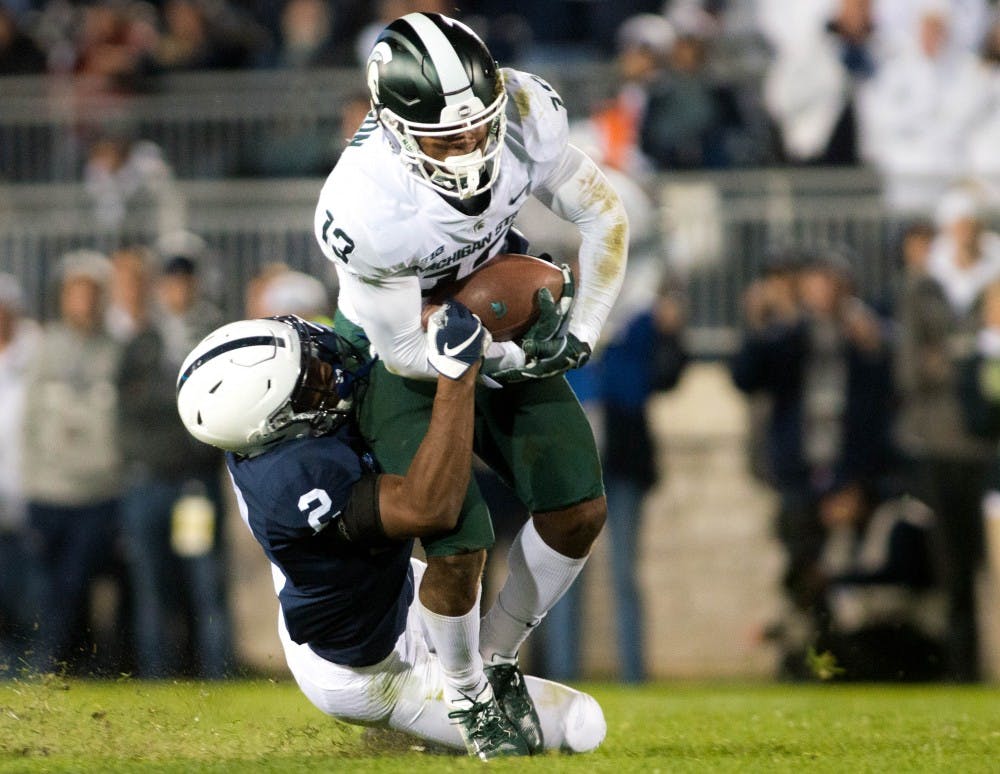 Sophomore wide receiver Laress Nelson (13) carries the ball during the game against Penn State at Beaver Stadium on Oct. 13, 2018. The Spartans defeated the Nittany Lions 21-17.
