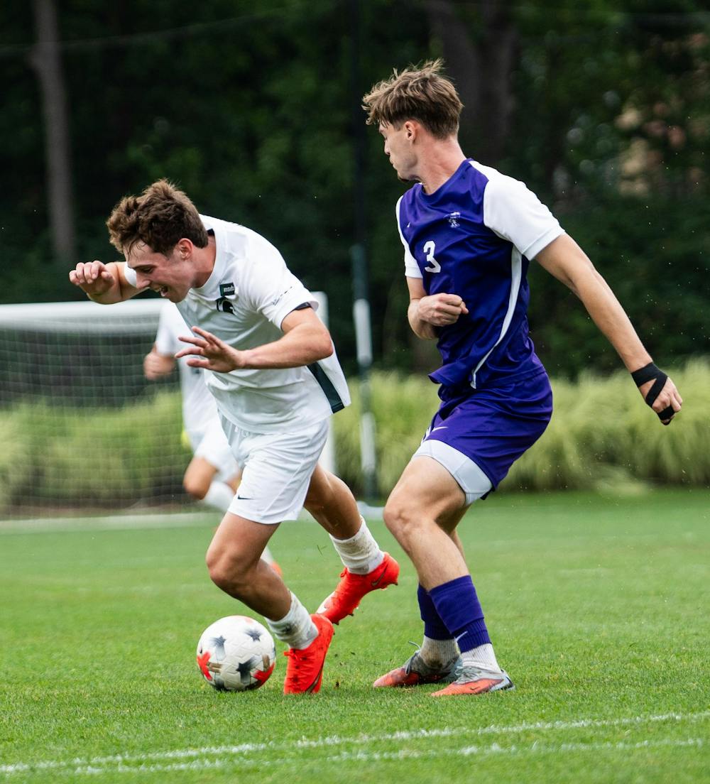 <p>Michigan state sophomore midfielder, Peter Soudan (17) trips over Niagara back Till Rauch (3) after carrying the ball up the field at DeMartin Stadium in East Lansing, Mich., on Sunday, Aug 30, 2026.</p>
