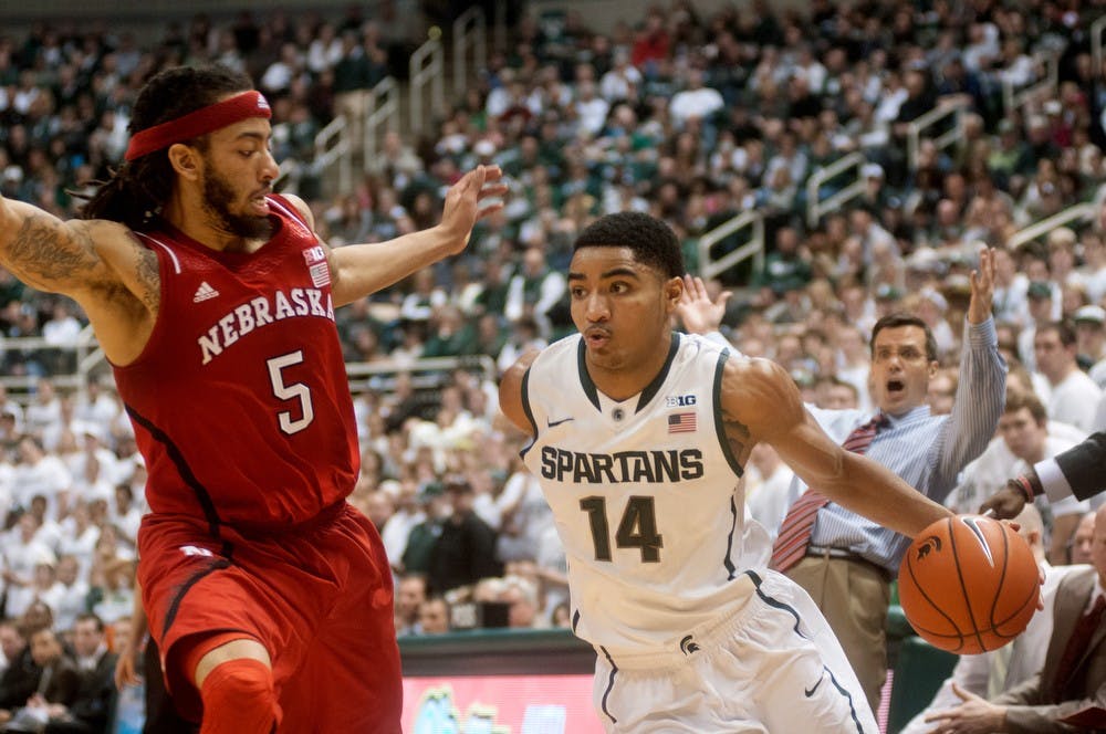 	<p>Sophomore guard Gary Harris dribbles towards the basket while guarded by Nebraska forward Terran Petteway on Feb. 16, 2014, at Breslin Center. Harris scored 9 points in the first half. Betsy Agosta/The State News</p>