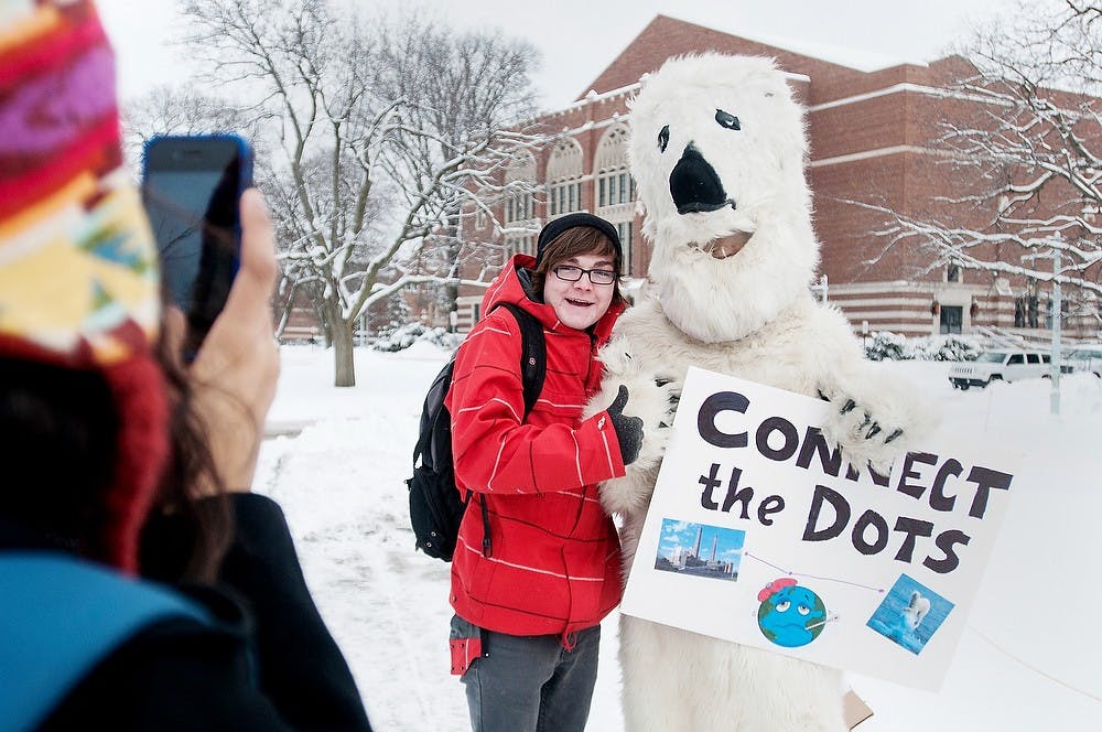 	<p>Hospitality management freshman Cameron Armstrong stands with physics junior Paul Matouka dressed as a polar bear at a petition for <span class="caps">MSU</span> Greenpeace on Feb. 8, 2013, at the rock on Farm Lane. <span class="caps">MSU</span> Greenpeace discussed environmental issues on campus. </p>
