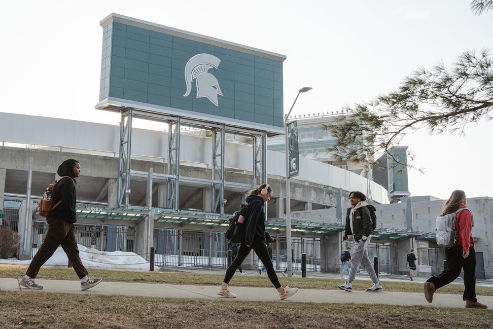 <p>Students walk past the Spartan Stadium on Feb. 16, 2026, in East Lansing, Michigan.</p>