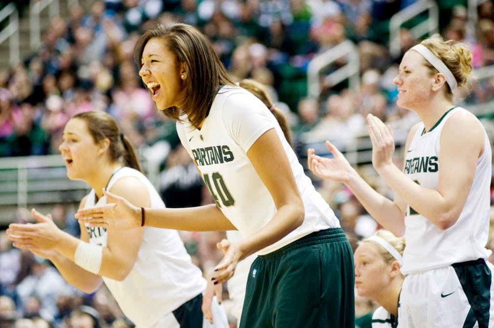 From left, freshman center Jasmine Hines, redshirt freshman center Madison Williams, and freshman Becca Mills celebrate near the end of second half as the Spartans secure a lead against Penn State. MSU defeated the Penn State Nittany Lions, 83-77, Sunday afternoon at Breslin Center. Justin Wan/The State News.