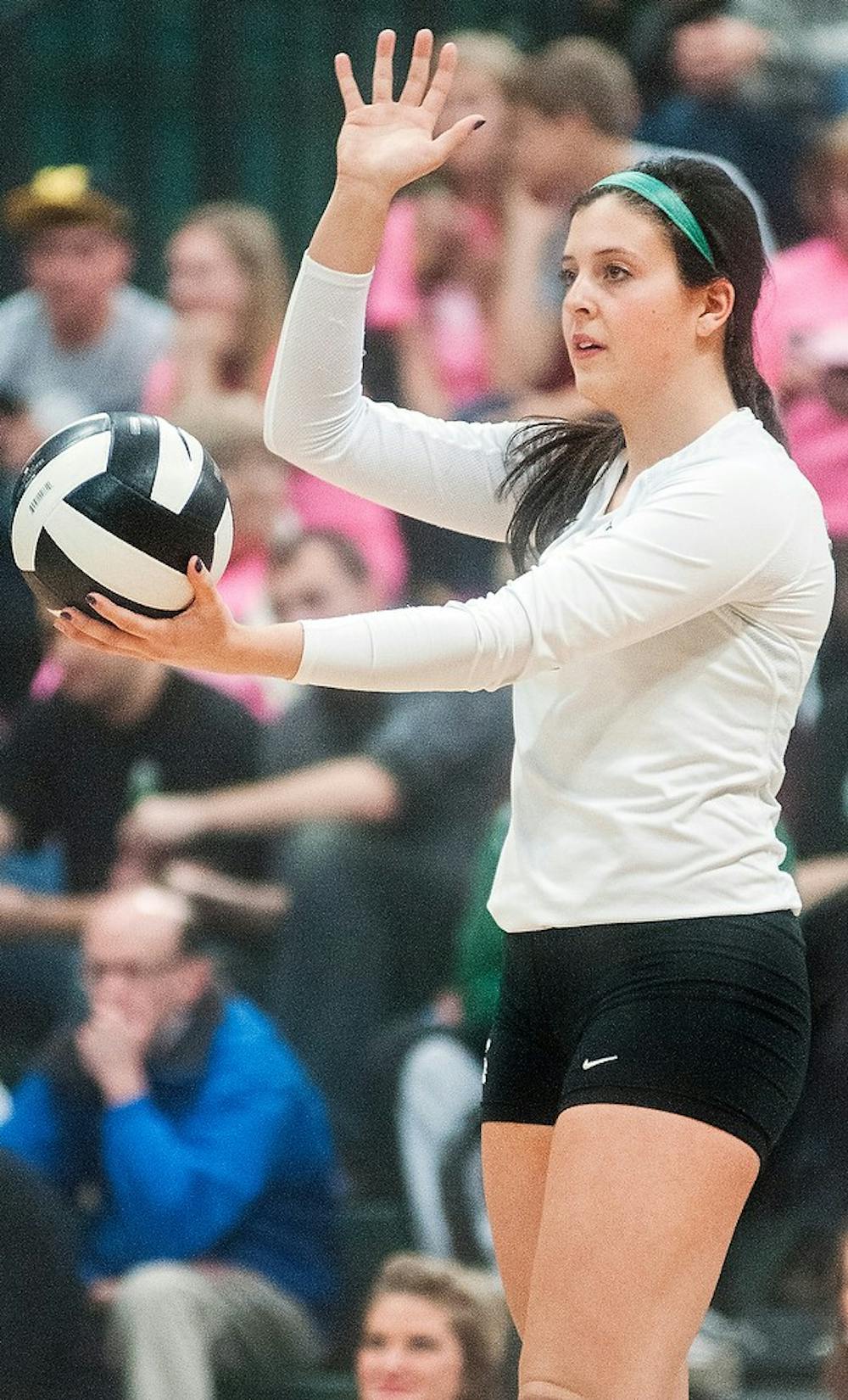 	<p>Freshman setter Halle Peterson prepares to serve the ball Wednesday, Nov. 21, 2012, at Jenison Field House. The Wolverines defeated the Spartans in three-straight sets during senior night for the Spartans. Adam Toolin/The State News</p>
