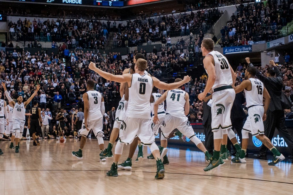 The Spartans rush the court after the game on March 13, 2016 at Bankers Life Fieldhouse in Indianapolis, Indiana. The Spartans defeated the Boilermakers, 66-62. 