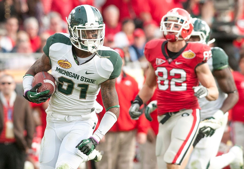 	<p>Then-sophomore cornerback Darqueze Dennard makes his 38-yard interception return at the end of third quarter, Jan 2, 2012, at Tampa, Fla. at the Outback Bowl. The Spartans defeated Georgia in triple overtime, 33-30. State News File Photo</p>